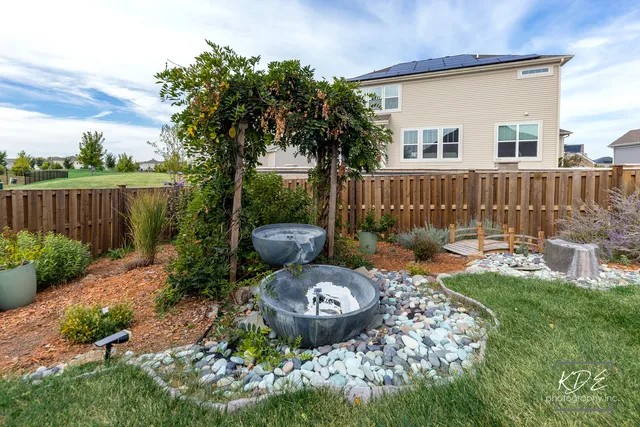 a view of a house with a yard and front view of a house