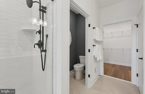 a bathroom with a double vanity sink mirror and shower