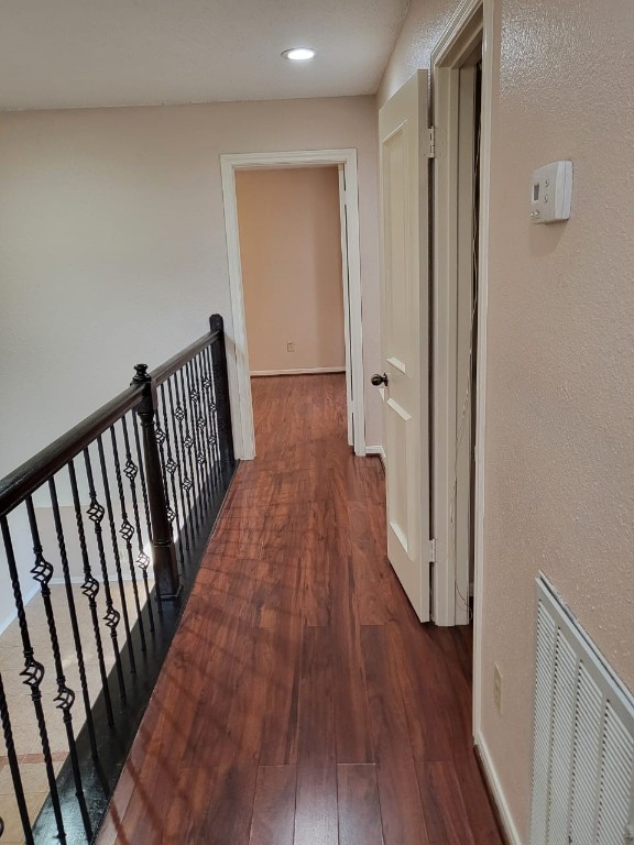 14810 Rancho Vista Drive Houston, TX 77083 - Photo 21 of 33 a view of a hallway with wooden floor and staircase