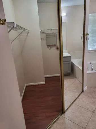 a bathroom with a bathtub and a sink