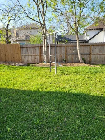 a view of a park with a large trees