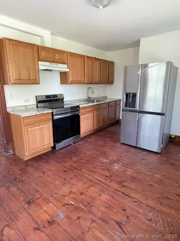 a bathroom with a tub and a sink