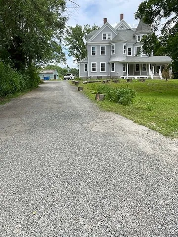 a view of street with parked cars