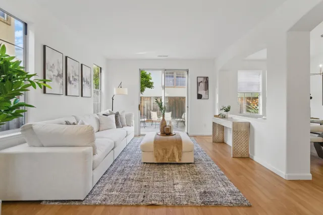 a living room with furniture and a rug