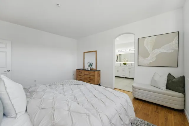 a bedroom with a bed and a couch