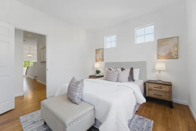 a bedroom with a bed and a couch