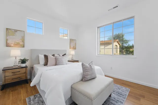 a bedroom with bed and a window