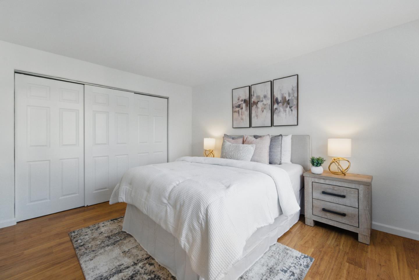 560 Villa Centre Way San Jose, CA 95128 - Photo 22 of 31 a bedroom with a bed and wooden floor