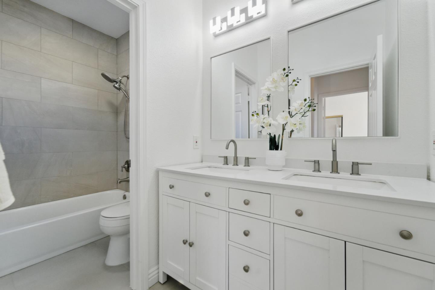 560 Villa Centre Way San Jose, CA 95128 - Photo 23 of 31 a bathroom with a granite countertop sink a toilet and a bathtub