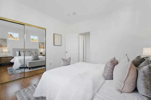 a bedroom with a bed and a couch