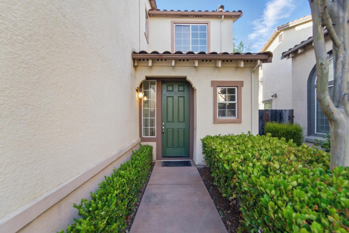 560 Villa Centre Way San Jose, CA 95128 - Photo 31 of 31 a view of a house with brick walls and a yard with plants