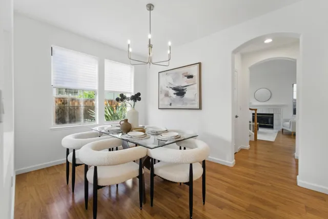 a view of a dining room with furniture window and wooden floor