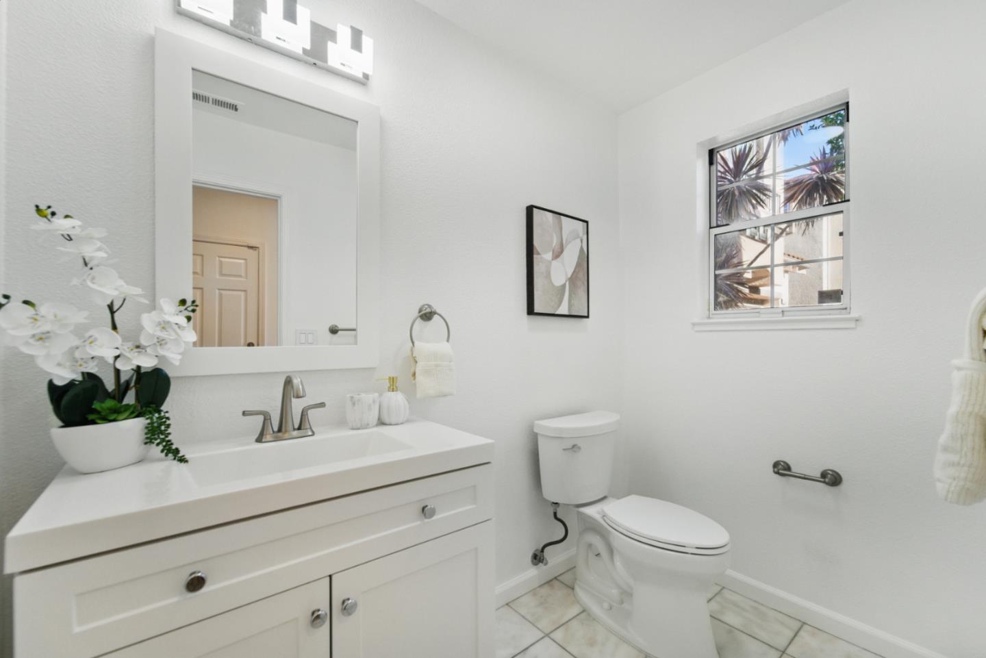 560 Villa Centre Way San Jose, CA 95128 - Photo 7 of 31 a bathroom with a sink mirror and toilet