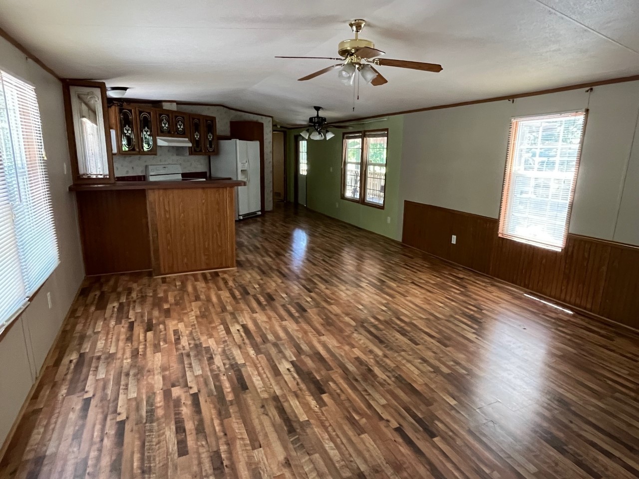 2692 Russell Road Palmyra, TN 37142 - Photo 8 of 21 a view of a living room and kitchen with wooden floor
