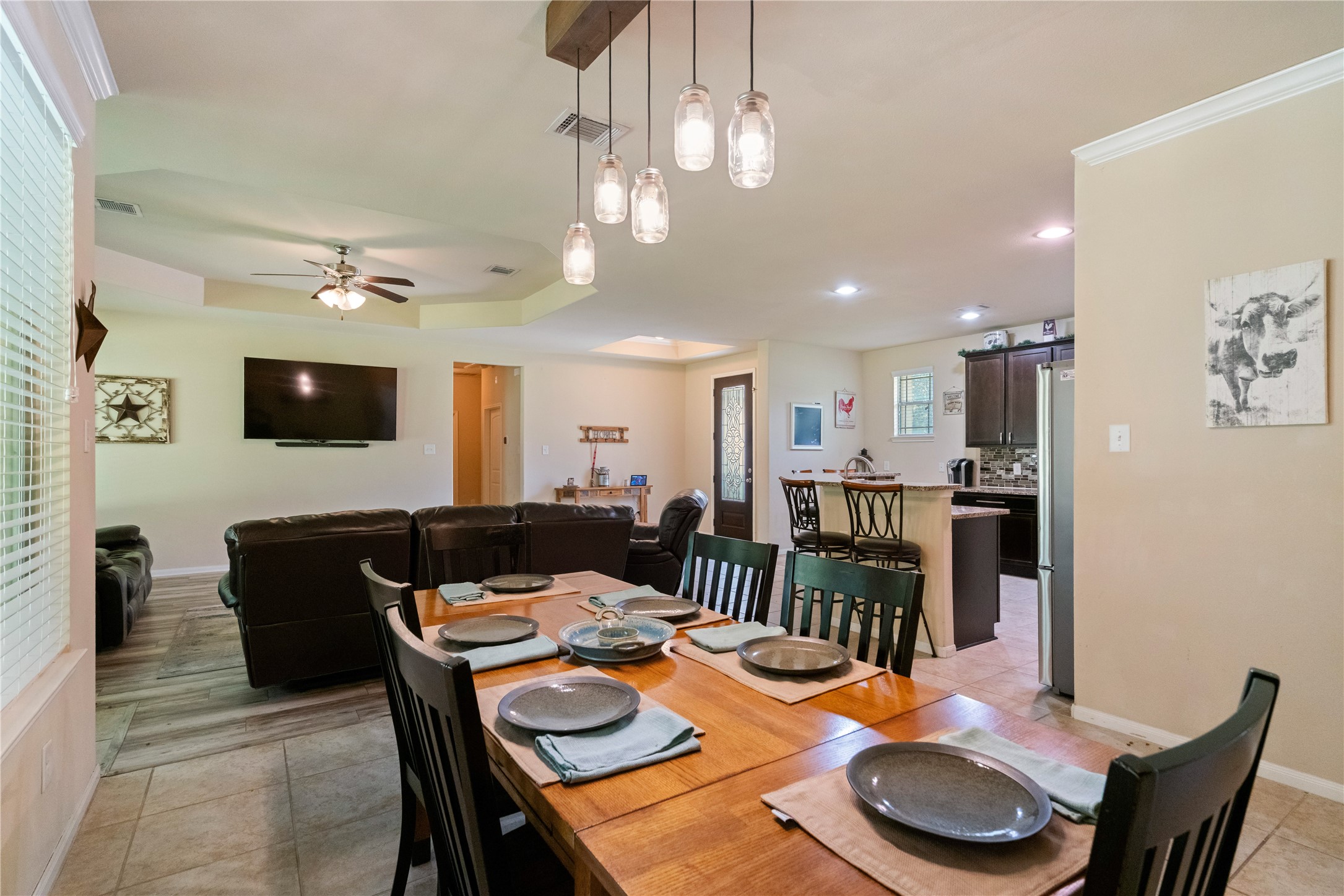 26806 Winding River Trail Huffman, TX 77336 - Photo 9 of 40 dining area open to living room and kitchen