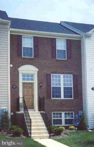 23 Baltic Avenue Ranson, WV 25438 - Photo 1 of 1 a front view of a house with garden