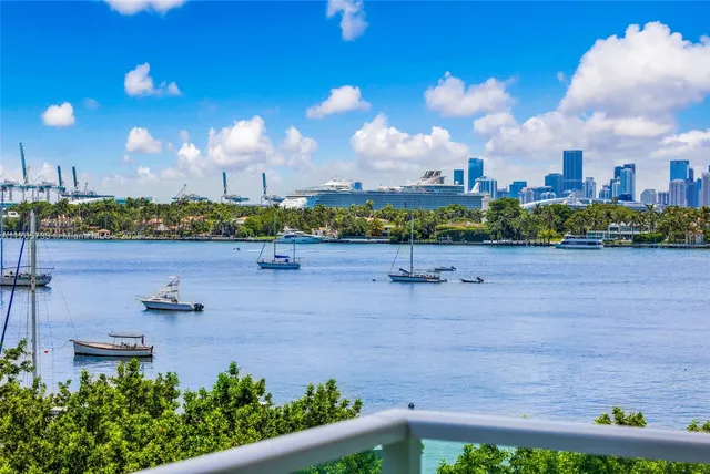 a view of a swimming pool with a yard