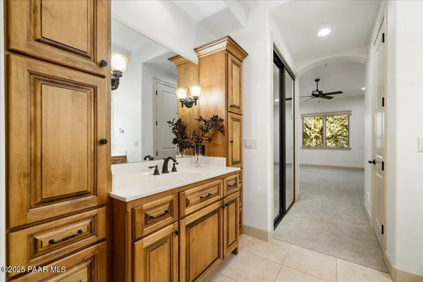 a bathroom with a sink a mirror and a shower