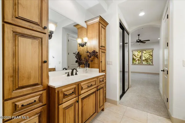 a bathroom with a sink a mirror and a shower