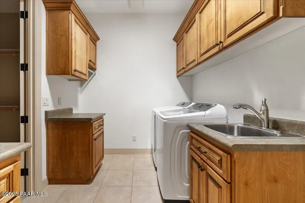 an empty room with closet and windows