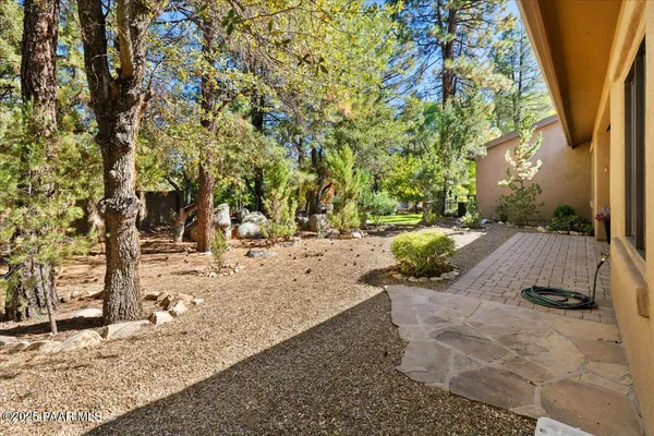 a front view of a house with garden and porch