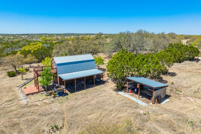 1135 Byas Springs Road Mountain Home, TX 78058 - Photo 5 of 23 a view of a terrace with a bench