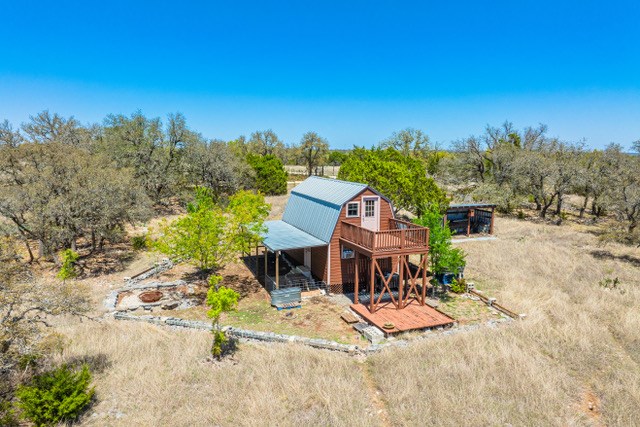 1135 Byas Springs Road Mountain Home, TX 78058 - Photo 6 of 23 a view of a town with large trees
