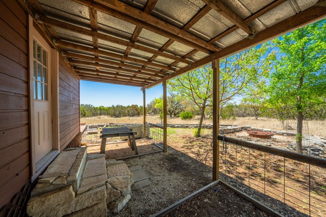 1135 Byas Springs Road Mountain Home, TX 78058 - Photo 9 of 23 a view of a porch with wooden floor