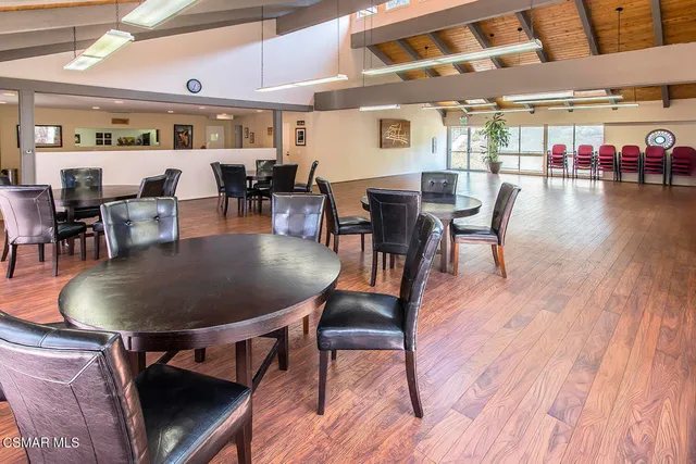 a kitchen with stainless steel appliances a sink stove top oven and cabinets