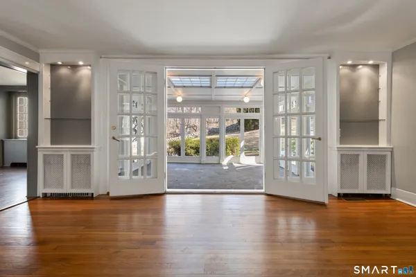 a view of an empty room with windows