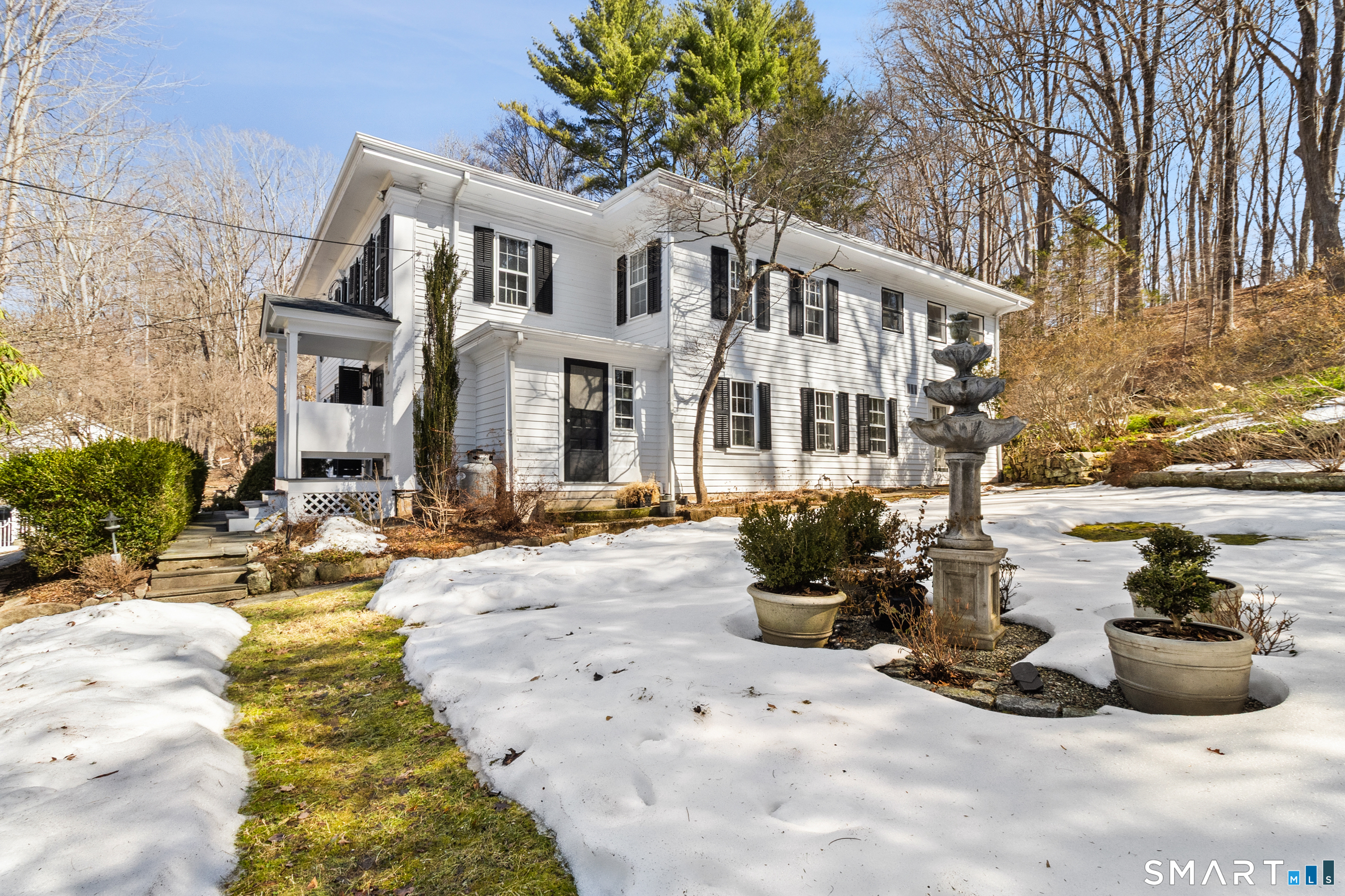 145 Lyons Plain Road Weston, CT 06883 - Photo 2 of 33 a view of a house with yard and sitting area