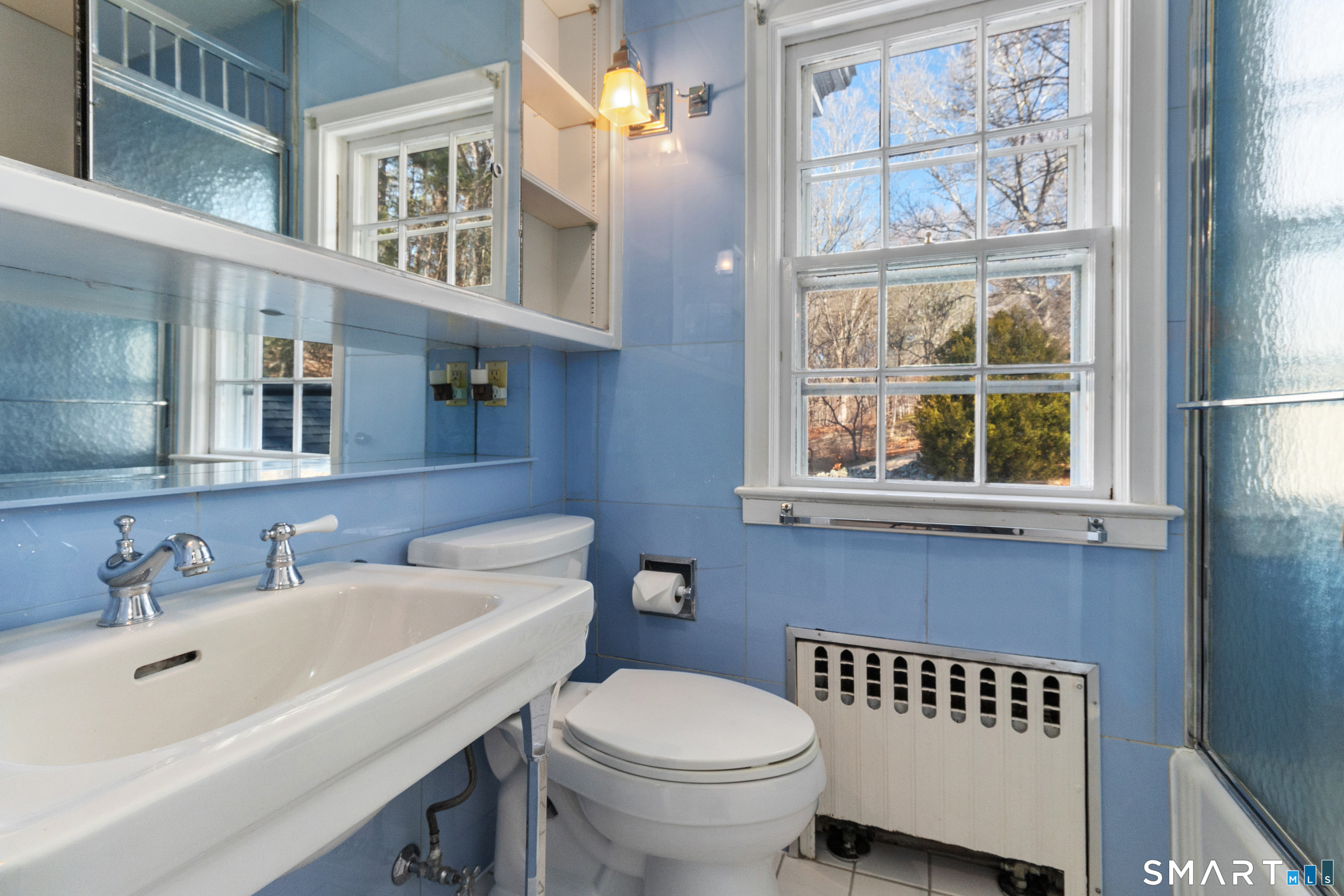 145 Lyons Plain Road Weston, CT 06883 - Photo 26 of 33 a bathroom with a sink and a toilet