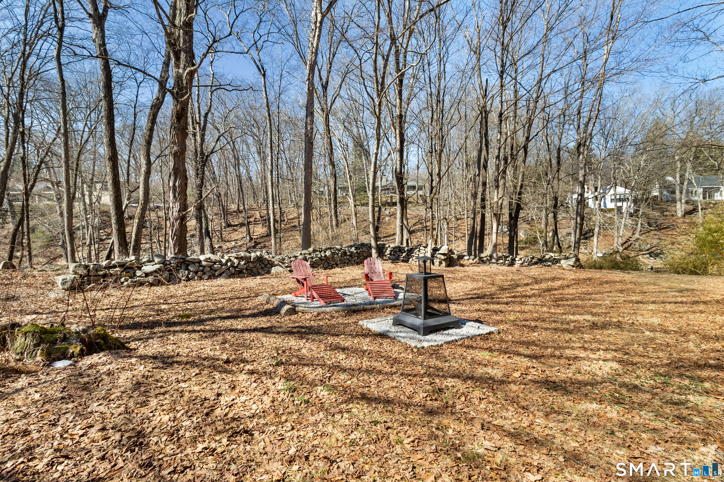 145 Lyons Plain Road Weston, CT 06883 - Photo 33 of 33 a view of a playground with a house