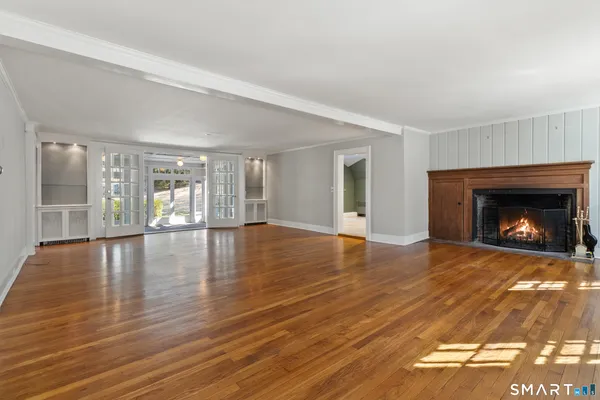 a view of a glass door with wooden floor