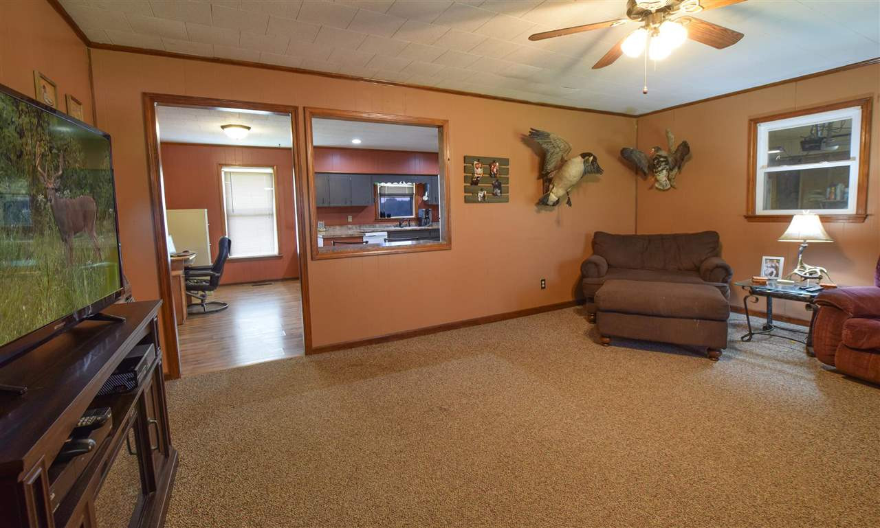 947 South Wolverine Road Troy, TN 38260 - Photo 11 of 20 a living room with furniture and a chandelier