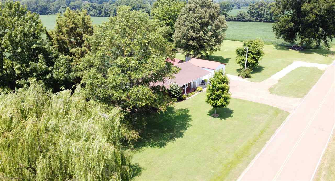 947 South Wolverine Road Troy, TN 38260 - Photo 4 of 20 a view of a lake with a yard