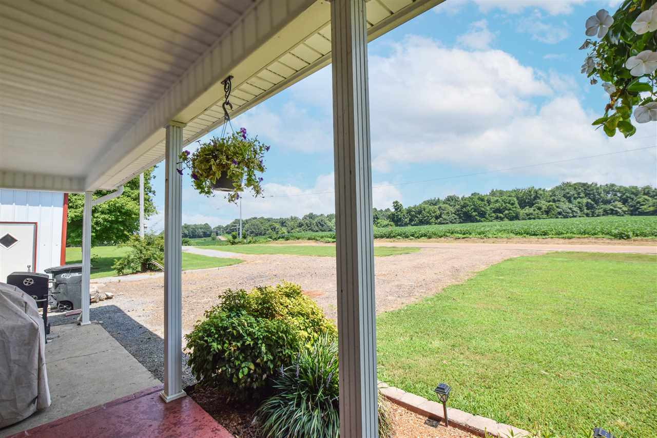 947 South Wolverine Road Troy, TN 38260 - Photo 6 of 20 a view of a lake from a porch