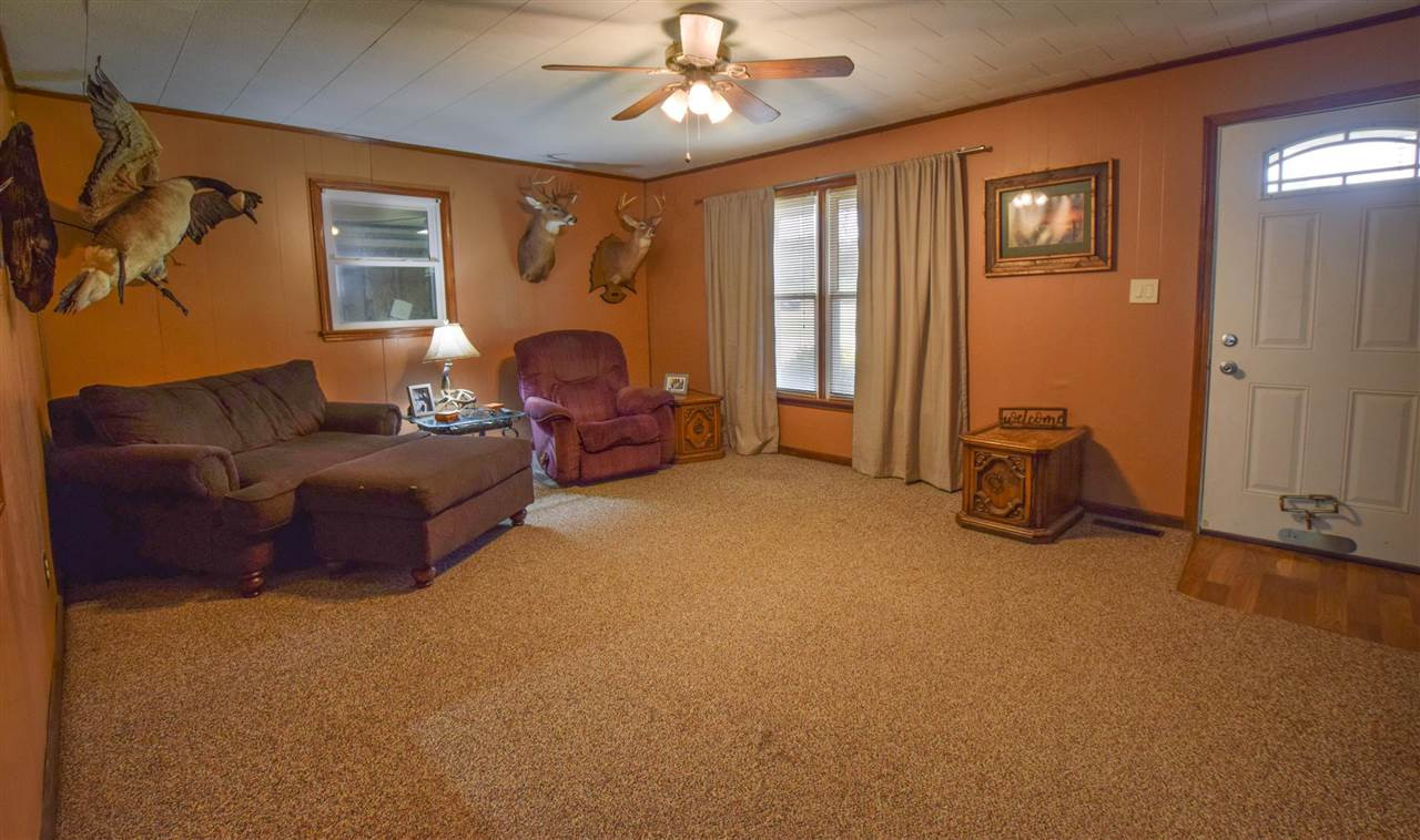 947 South Wolverine Road Troy, TN 38260 - Photo 10 of 20 a living room with furniture and a fireplace