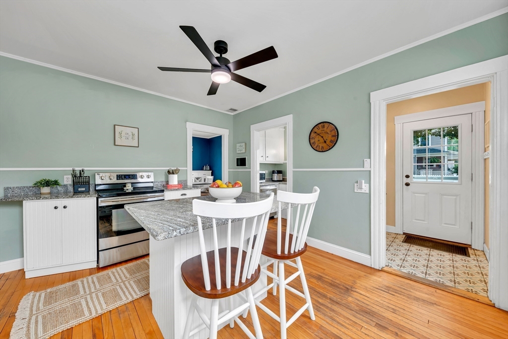7 Melrose Street Amesbury, MA 01913 - Photo 13 of 34 a view of a dining room with furniture and wooden floor