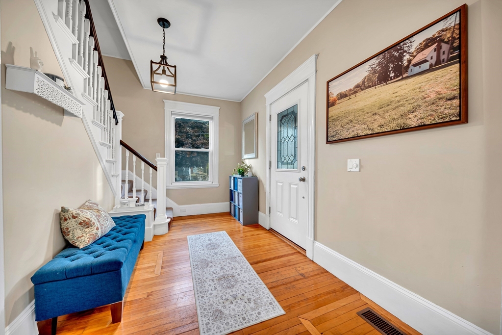 7 Melrose Street Amesbury, MA 01913 - Photo 15 of 34 a living room with furniture and a rug