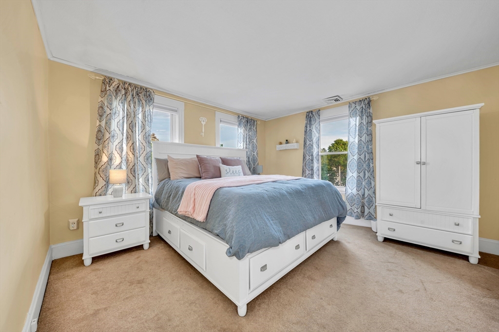 7 Melrose Street Amesbury, MA 01913 - Photo 19 of 34 a bed room with a bed and a window