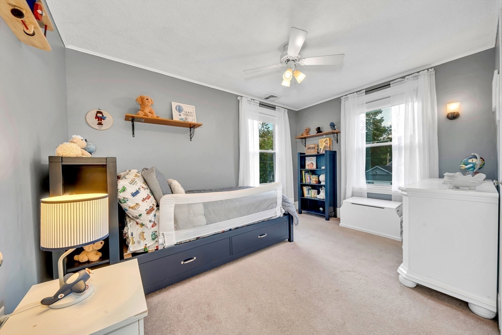 7 Melrose Street Amesbury, MA 01913 - Photo 20 of 34 a bedroom with a bed and a large window