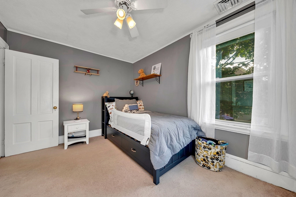 7 Melrose Street Amesbury, MA 01913 - Photo 21 of 34 a bedroom with a bed and a window