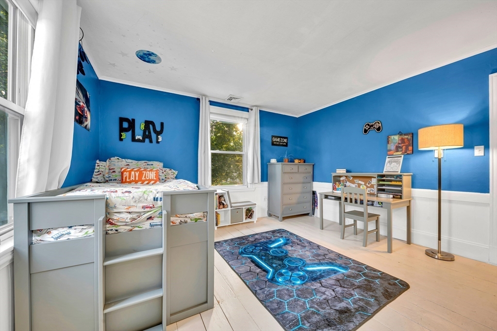 7 Melrose Street Amesbury, MA 01913 - Photo 23 of 34 a living room with furniture and a rug