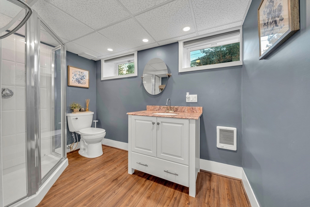 7 Melrose Street Amesbury, MA 01913 - Photo 29 of 34 a bathroom with a sink mirror vanity and toilet