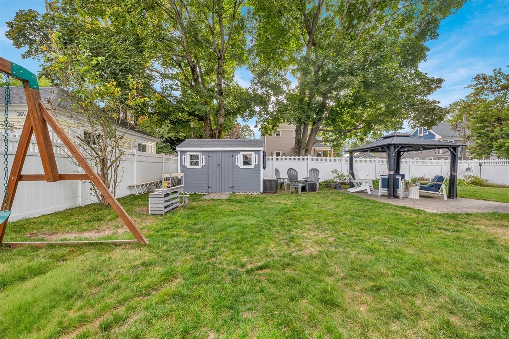7 Melrose Street Amesbury, MA 01913 - Photo 34 of 34 a view of a house with backyard and a tree