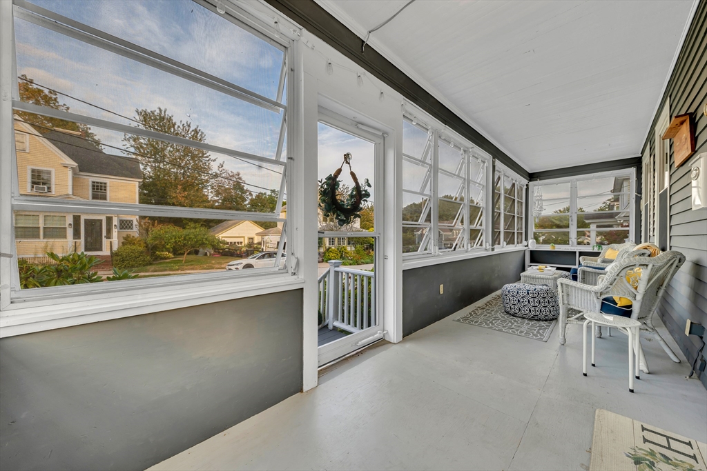 7 Melrose Street Amesbury, MA 01913 - Photo 4 of 34 a living room with furniture and a large window