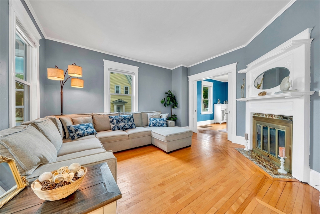 7 Melrose Street Amesbury, MA 01913 - Photo 7 of 34 a living room with furniture and a fireplace