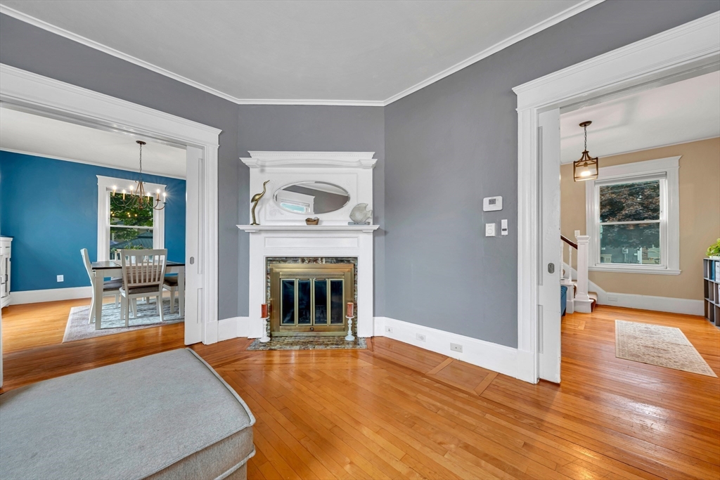 7 Melrose Street Amesbury, MA 01913 - Photo 9 of 34 a living room with furniture and a fireplace