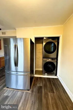 a view of kitchen and wooden floor